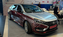 Lada Aura with a body kit and a tablet on the "Aurora" OS was shown at SPIEF