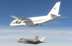 Elephant and Mops: Photo of Russian An-124 "Ruslan" Escorted by Italian Air Force F-35A Fighter Appears