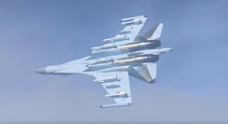 A stunt on the edge: an ace in a Su-35S performed a "half-roll" meters away from a civilian airliner