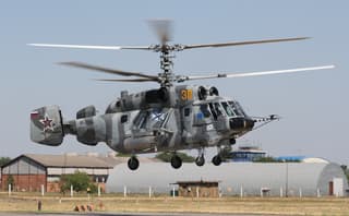 Ka-29 and Mi-8-MTV-5-1 helicopter crews launch unguided aircraft missiles during exercises in the Arctic
