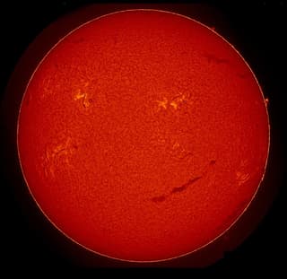 The Sun "smiled" and erupted in a powerful flare on February 13