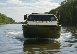 Amphibious all-terrain vehicle with a propeller for food delivery developed for the military