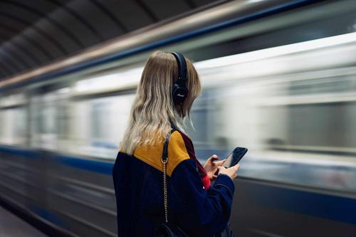 Girl with a smartphone in the Moscow metro<br>