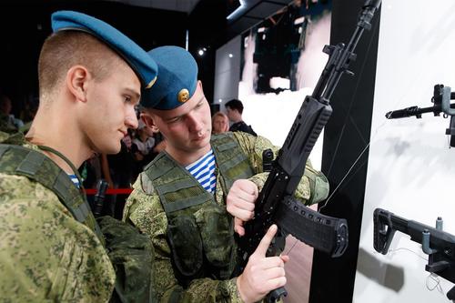VDV fighters inspect a stand with Kalashnikov small arms