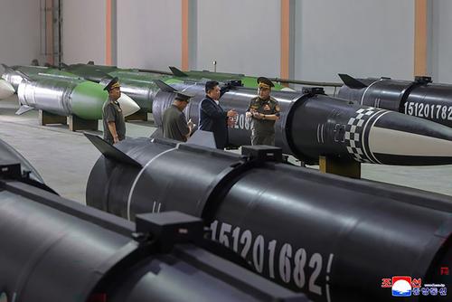 North Korean leader Kim Jong-un inspects one of the missile production facilities