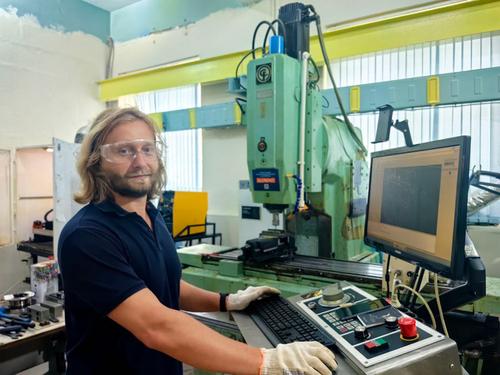 Specialist from NSTU at the machine, archive photo