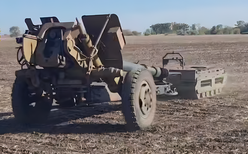 "Courier" tows a 122-mm D-30 howitzer