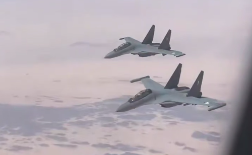 Su-30MKA of the Algerian Air Force escorting the plane of the Pope