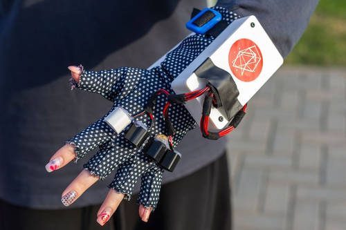 Glove with module and vibratory motor