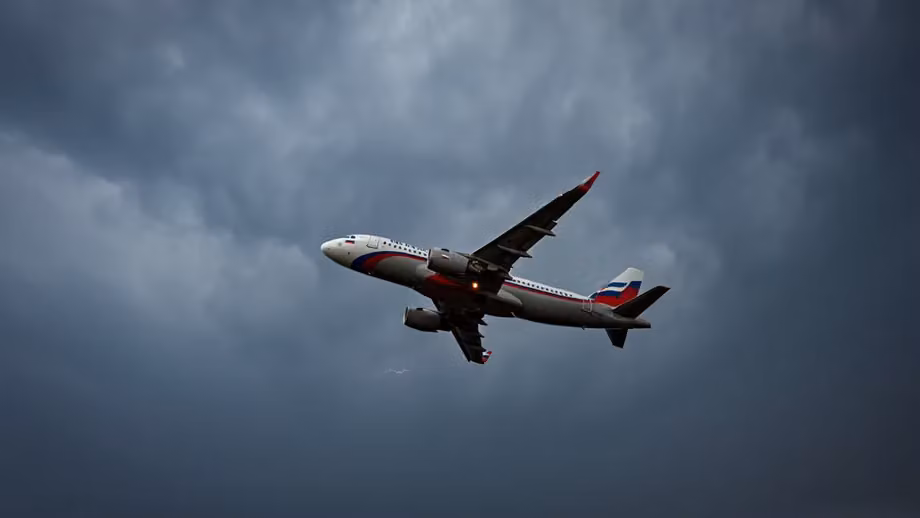 Airplane in storm clouds