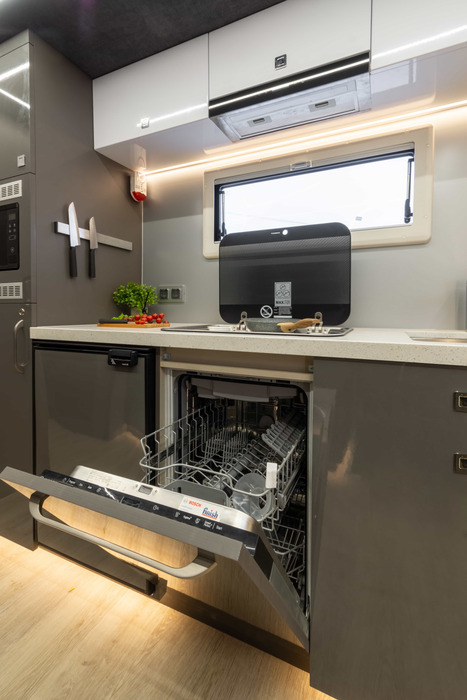 So far, not every Russian kitchen has a dishwasher, but there was a place for it in the motorhome. There was also a place for a refrigerator and a separate freezer, a microwave oven and a coffee machine