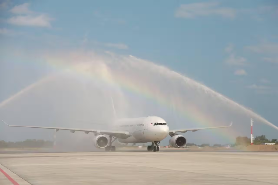 Aircraft under a water arch